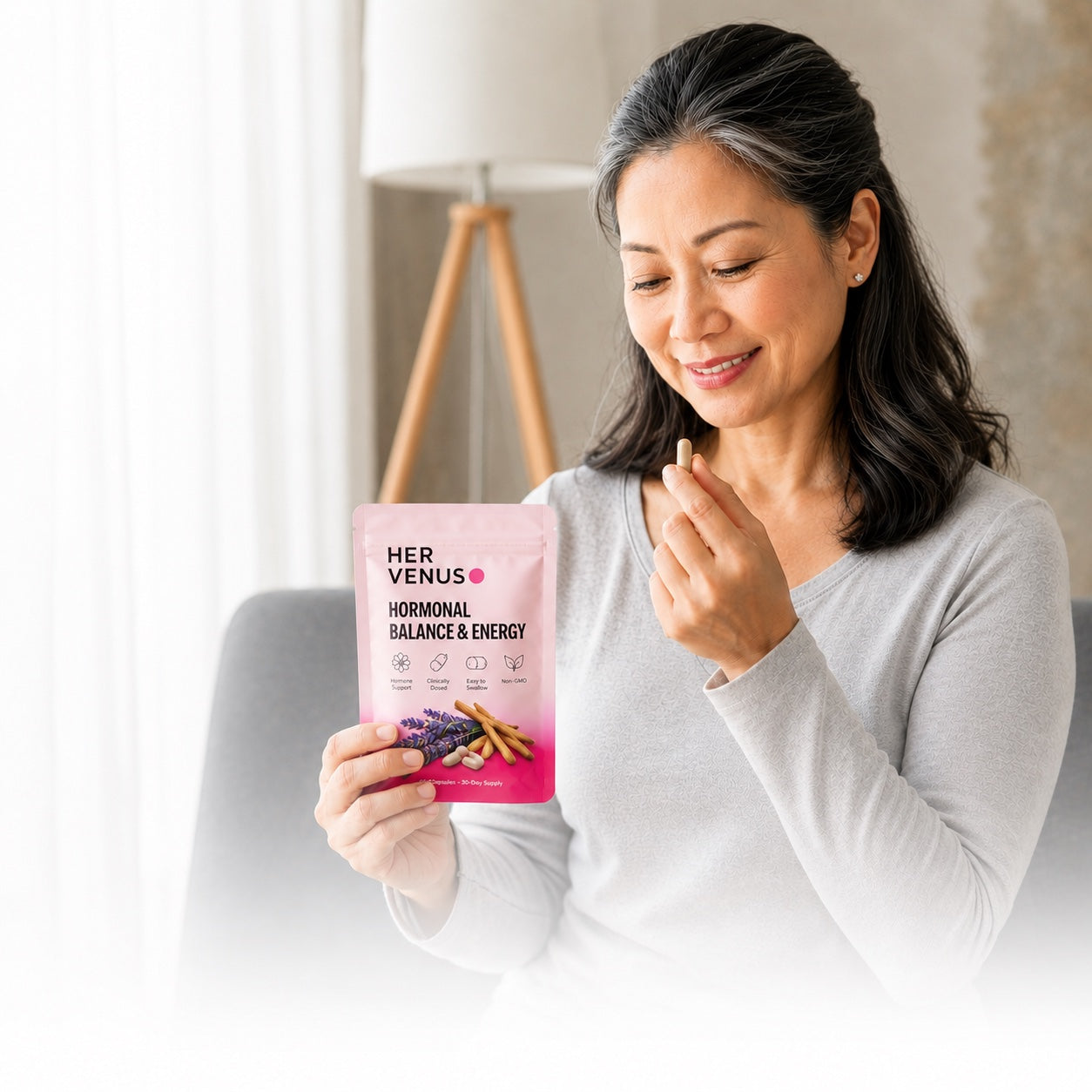 Woman holding HER VENUS Hormonal Balance & Energy